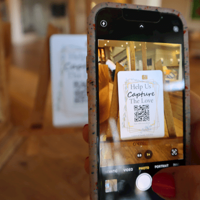 iPhone scanning a luxury wedding QR code